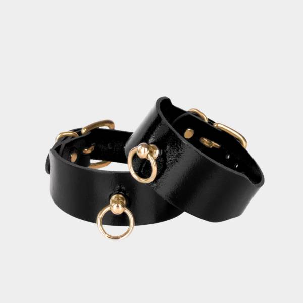 Menottes de chevilles en cuir noir et or